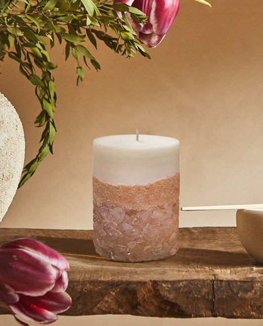 Rose Quartz Crystal Candles Displayed on a Wooden Shelf Bringing Elegance and Beauty to Home Decor