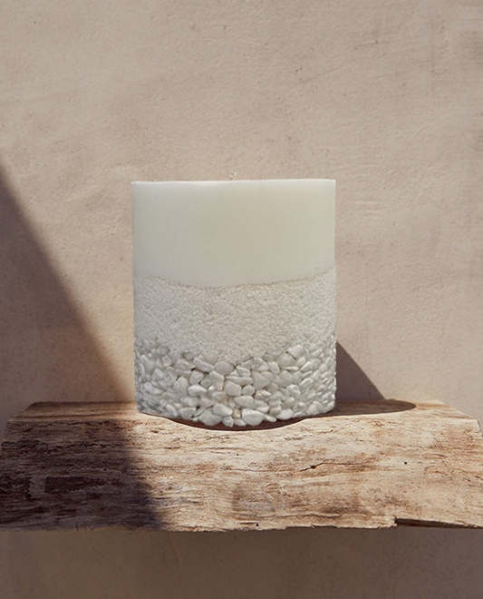 White Crystal Candle Placed on a Wooden Shelf to Be Used in Home Decoration.