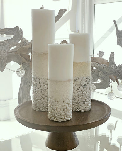 Three Howlite Crystal Candles Displayed on the Coffee Table of a Home Showing How This Decorative Item Brings a Statment and Bold Look